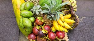 Tropical fruit Basket in Bali with pineapple, banana, mangosteen, papaya, watermelon and mango