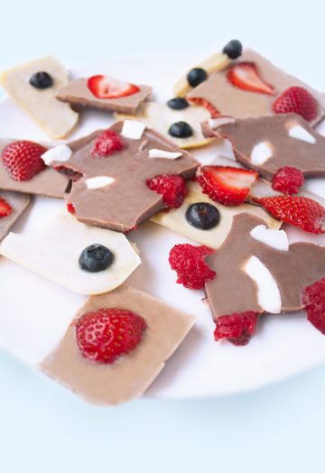 Healthy vegan chocolate bark with berries and coconut flakes